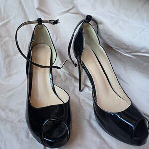 Black peep toe patent leather stilletos